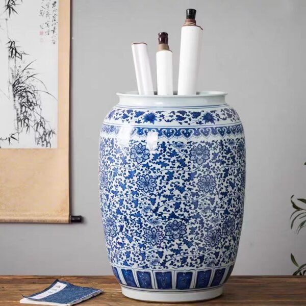 A large-sized Jingdezhen ceramic storage jar adorned with blue and white porcelain designs, ideal for storing calligraphy scrolls in the study or as a stylish decorative item for the living room. This elegant and vintage-style jar serves as a perfect display piece for your home, adding a touch of sophistication and high-end charm to your living space.